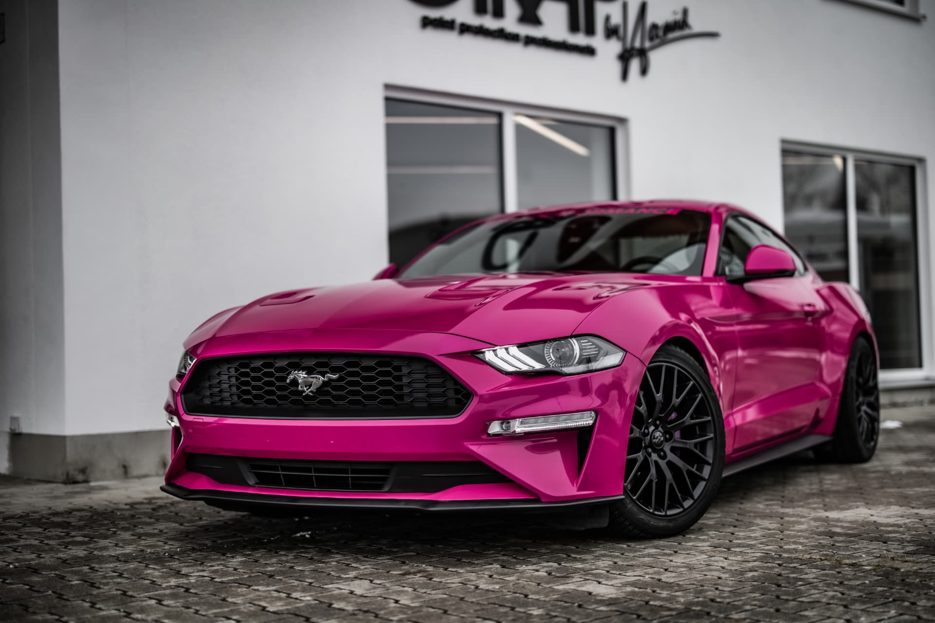Ford Mustang finished in a gloss pink color change wrap